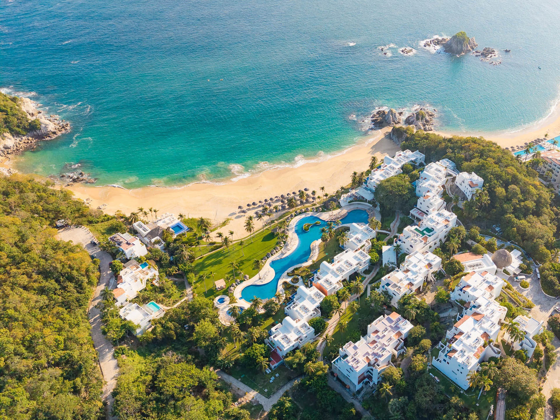 Wide sandy beach and resorts at Tangolunda Bay, Huatulco